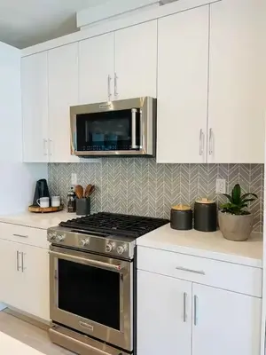 a kitchen with a stove and a microwave at #Marbella Lane-Luxury Designer 3BR Home Disneyland in Anaheim