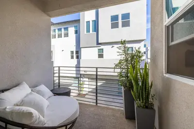 a living room with a couch and a large window at #Marbella Lane-Luxury Designer 3BR Home Disneyland in Anaheim
