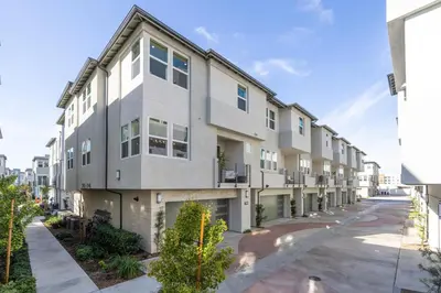 an apartment building with balconies on a street at #Marbella Lane-Luxury Designer 3BR Home Disneyland in Anaheim