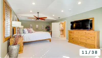 a bedroom with a bed and a flat screen tv at Emeric Estate in Simi Valley