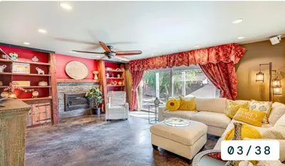 a living room with a couch and a fireplace at Emeric Estate in Simi Valley