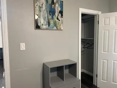 a room with a painting on the wall and a table at Faith House in Los Angeles