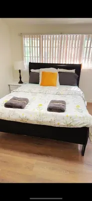 a bed with two pillows on it in a bedroom at Pretty bedroom private bathroom in Hacienda Heights