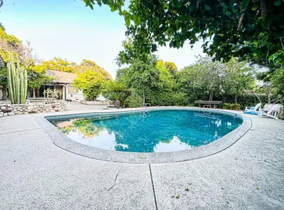 a swimming pool in the middle of a yard at Cozy 1-BR Poolside Getaway in West LA - LOU2 - WW in Los Angeles