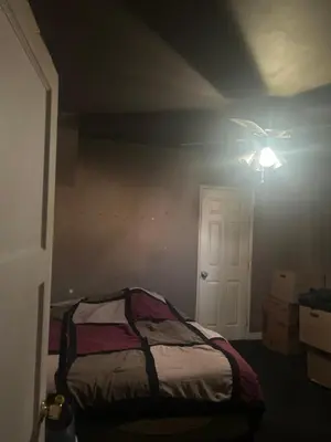 a bedroom with a bed and a ceiling fan at Cheryls home in Inglewood