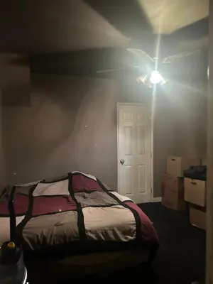 a bedroom with a bed and a ceiling fan at Cheryls home in Inglewood
