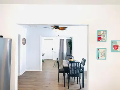 a dining room with a table and chairs at Cozy Home Away From Home in Mojave