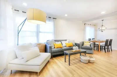 a living room with a couch and a table at Centrally Located Charming LA Home with Food Scenes in Monterey Park