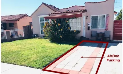 a picture of a house with a backyard at Cozy Spacious, free parking, near it all in South Gate