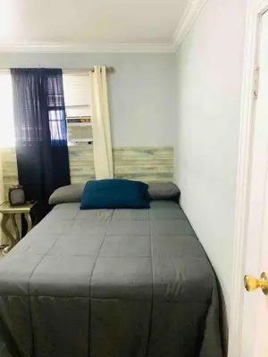 a bedroom with a large bed in a room at Cozy Spacious, free parking, near it all in South Gate