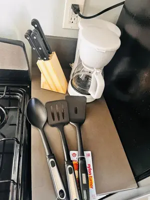 a kitchen counter with utensils and a blender at Cozy Serene Studio Backhouse w parking near it all in South Gate