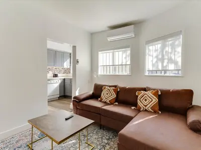 a living room with a couch and a table at Modern 3 Bedroom Apartment in San Fernando in San Fernando