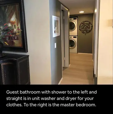 a hallway with the left and straight is in unit washer and dryer at Best Location West LA Spacious condo with hottub in Los Angeles