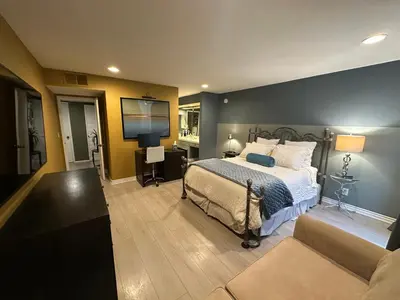 a bedroom with a bed and a couch at Best Location West LA Spacious condo with hottub in Los Angeles