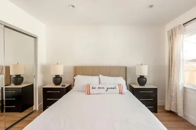 a bedroom with a bed with a sign on it at Stylish Gated Retreat in East Hollywood with Parking in Los Angeles