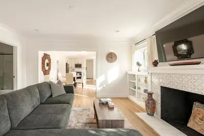 a living room with a couch and a fireplace at Stylish Gated Retreat in East Hollywood with Parking in Los Angeles
