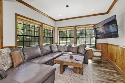 a living room with a couch and a coffee table at Serenity Cove Lake House by Big Bear Vacations in Big Bear Lake