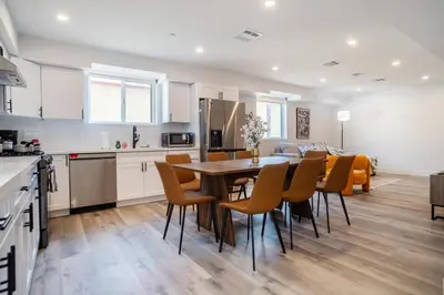 a kitchen and dining room with a table and chairs at Stylish & Cozy Retreat Near USC & Downtown LA in Los Angeles