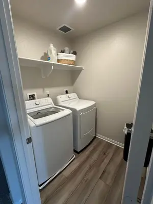 a small laundry room with a washer and dryer at 3 bed 3 Bath Gated Corner unit in Upland
