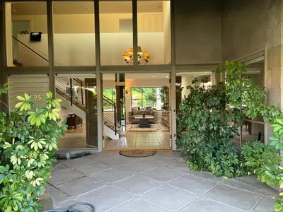 an open lobby of a house with plants at Porter Paradise in Deer Lake Highlands