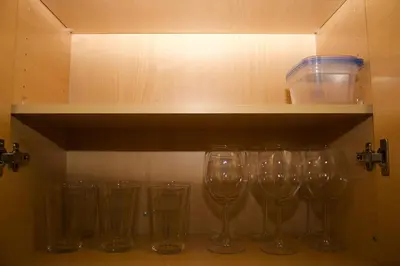 a row of wine glasses sitting on a shelf at Studio Luxury Marina del Rey with parking gym pool in Los Angeles