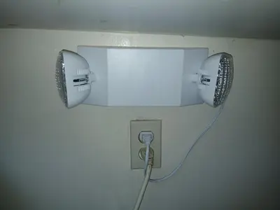 a lightswitch with a cord plugged into a wall at Private room furnished Cypress in Lomita