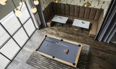 an overhead view of a pool table with a butterfly on it at Vibrant unit in Griffith in Glendale