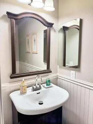 a bathroom with a white sink and a mirror at Modern & Spacious Family and Friend 4B3B House in Moreno Valley
