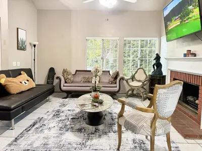a living room with a couch and a fireplace at Modern & Spacious Family and Friend 4B3B House in Moreno Valley