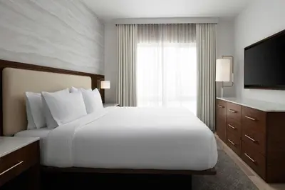 a hotel room with a bed and a television at TownePlace Suites by Marriott Ventura Oxnard in Oxnard