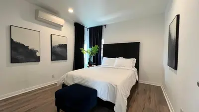 a bedroom with a white bed and a window at Spacious 3BR 3BA Home Private Yard in Culver City in Los Angeles