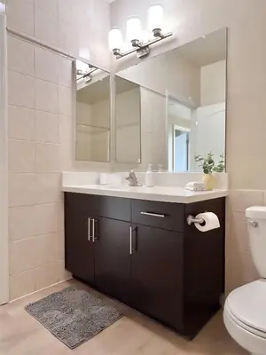 a bathroom with a sink and a mirror at Modern Top Floor 3BD 3BA Condo Marina del Rey in Los Angeles