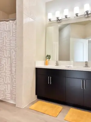 a bathroom with a sink and a mirror at Modern Top Floor 3BD 3BA Condo Marina del Rey in Los Angeles