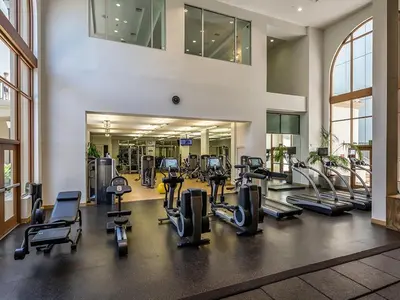 a gym with treadmills and cardio equipment in a building at Surfs up! Cozy 1 Bedroom Condo with Fountain View in Los Angeles