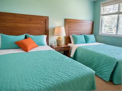 two beds sitting next to each other in a bedroom at Modern Venice Beach Stay - Walk to Marina & Boardwalk in Los Angeles