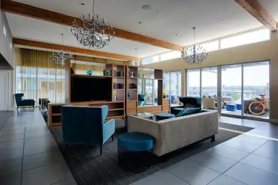 a living room with a couch and a tv at Modern Venice Beach Stay - Walk to Marina & Boardwalk in Los Angeles
