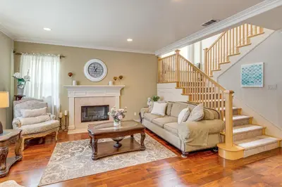 a living room with a couch and a fireplace at 6 Mi to Dtwn Pasadena Home with Patio and Yard! in San Gabriel