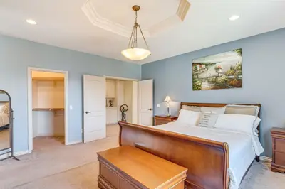 a bedroom with a large bed and a table at 6 Mi to Dtwn Pasadena Home with Patio and Yard! in San Gabriel