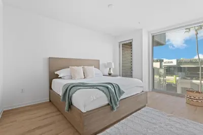 a white bedroom with a large bed and a window at The rose-Spacious 3-Bedroom Retreat in the Heart of Marina del Rey in Los Angeles