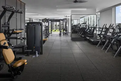 a gym with a lot of treadmills and machines at The rose-Spacious 3-Bedroom Retreat in the Heart of Marina del Rey in Los Angeles