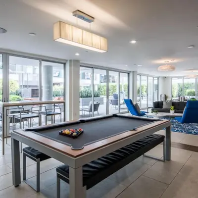 a pool table in a living room with a pool table at The rose-Spacious 3-Bedroom Retreat in the Heart of Marina del Rey in Los Angeles