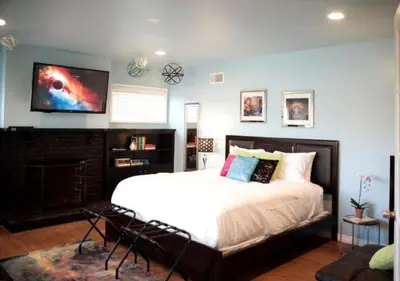 a bedroom with a bed and a tv on the wall at MagicwayVillas Paradise Pier Home - Across Disney in Anaheim