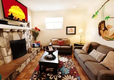 a living room with a couch and a fireplace at MagicwayVillas LionQueen - Pool and Spa in Anaheim