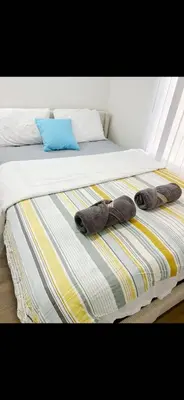 two stuffed animals are laying on a bed at New renovated room with shared bathroom in Hacienda Heights
