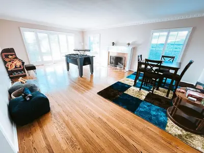 a living room with a couch and a table at Cozy 4BR home near SoFi in the City Of Champions in Inglewood