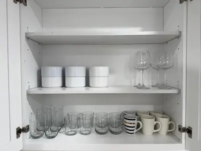 a cupboard filled with glasses and wine glasses at Stylish & Cozy Retreat in the Heart of LA in Los Angeles