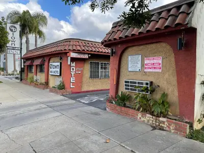 a building on the side of a street at Uptown Inn in Long Beach