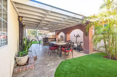 a patio with a table and chairs on it at Peaceful Oasis in Anaheim
