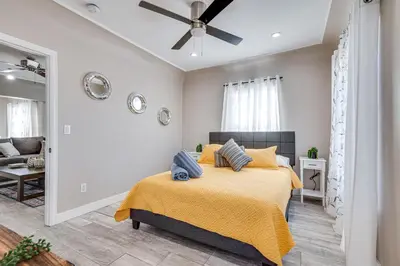 a bedroom with a bed and a ceiling fan at 7 Mi to Downtown East Los Angeles Apartment in East Los Angeles