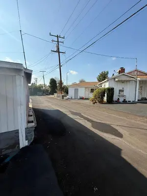 an empty street in a town with at El Rancho Motel, Pasadena in Pasadena